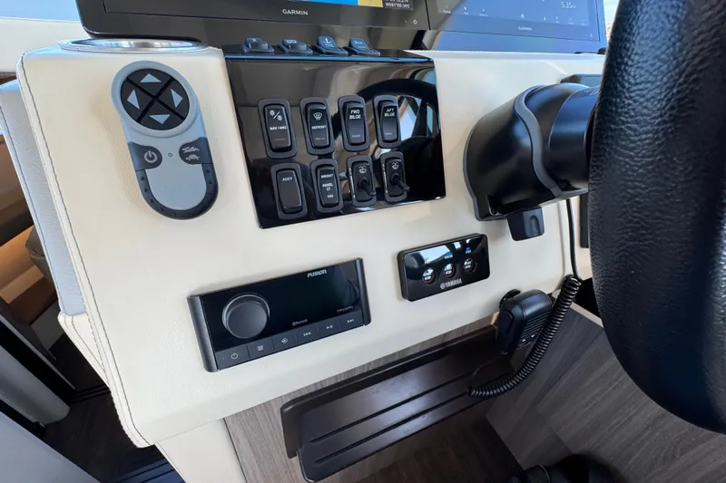 Irresistible Yacht Photos Pics Control panel of 2021 Regal 38 XO boat with various switches and devices.
