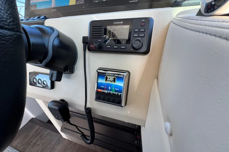 Irresistible Yacht Photos Pics Control panel of 2021 Regal 38 XO boat with Garmin navigation system.