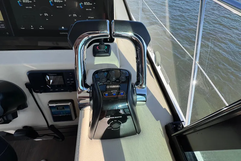 Irresistible Yacht Photos Pics 2021 Regal 38 XO boat helm with Yamaha controls and Garmin display.