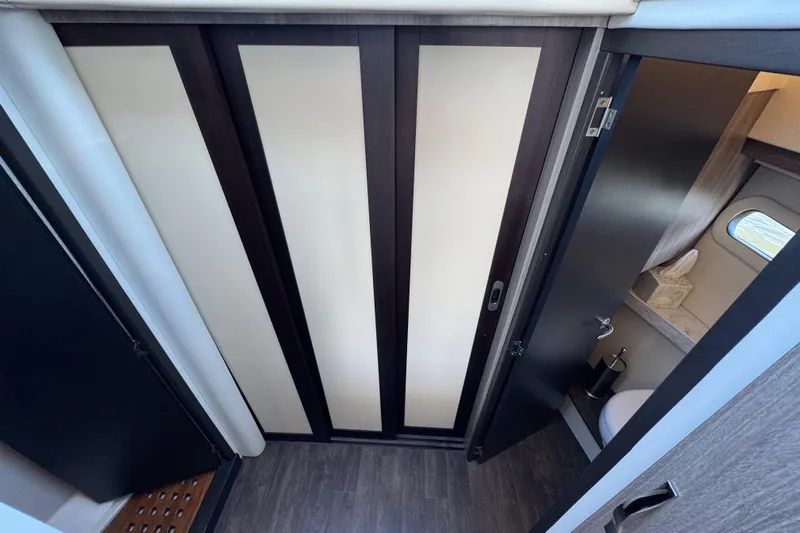 Irresistible Yacht Photos Pics 2021 Regal 38 XO yacht interior with modern bathroom and sleek design.