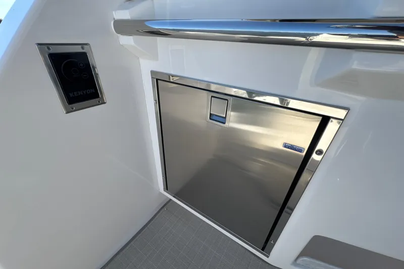 Irresistible Yacht Photos Pics Stainless steel appliance on 2021 Regal 38 XO yacht with Kenyon control panel.