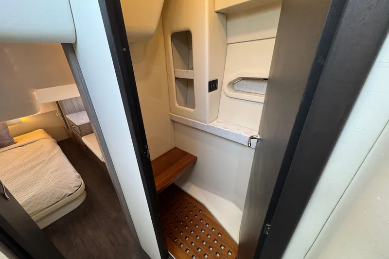 Irresistible Yacht Photos Pics 2021 Regal 38 XO yacht interior with cozy cabin and modern amenities.