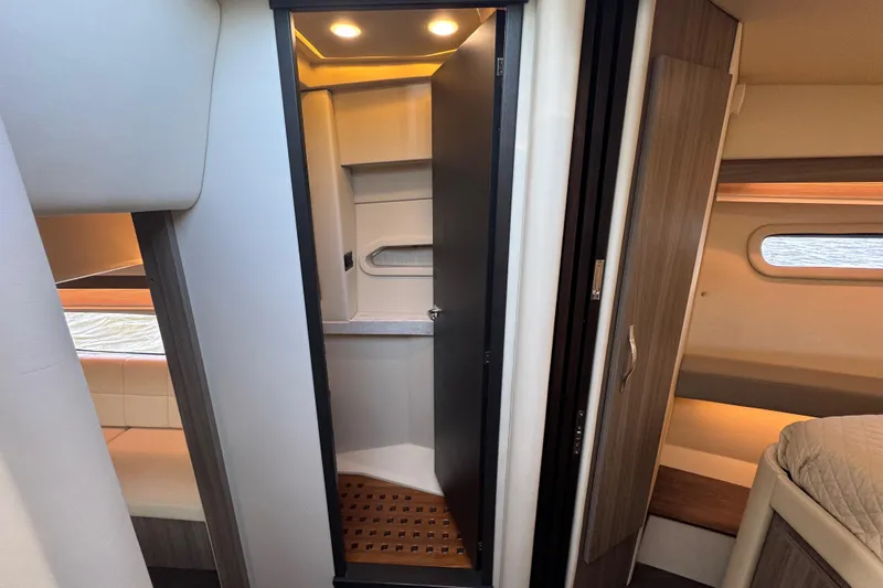 Irresistible Yacht Photos Pics 2021 Regal 38 XO yacht interior with modern bathroom and cozy cabin.