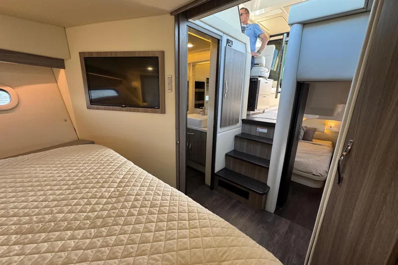 Irresistible Yacht Photos Pics Luxurious interior of 2021 Regal 38 XO yacht featuring cozy bedrooms and modern amenities.