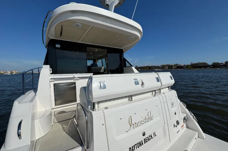 Irresistible Yacht Photos Pics 2021 Regal 38 XO yacht named "Irresistible" docked at Daytona Beach, FL.