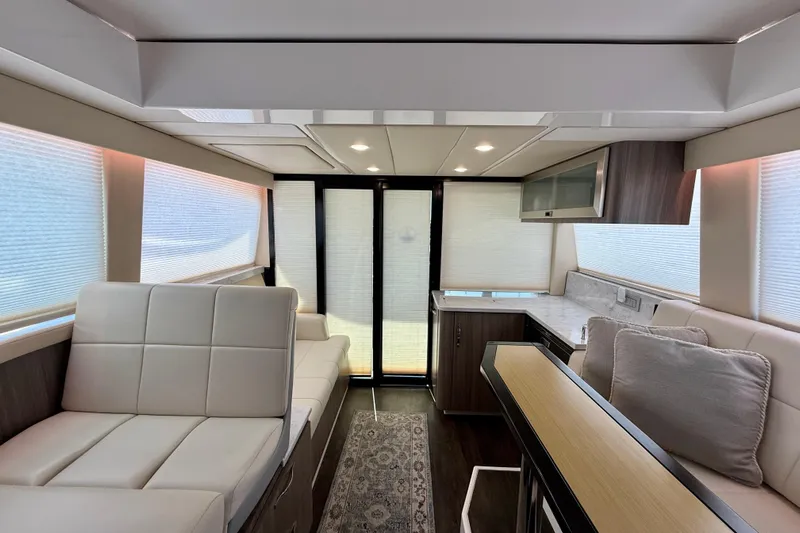 Irresistible Yacht Photos Pics Luxurious interior of 2021 Regal 38 XO yacht with modern seating and elegant design.