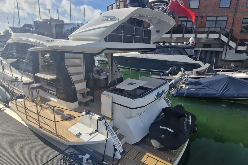 Alouise Yacht Photos Pics 2022 Galeon 460 Fly yacht docked at marina, showcasing sleek design and spacious deck.