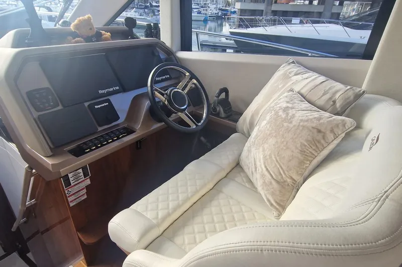 Alouise Yacht Photos Pics Luxurious helm of 2022 Galeon 460 Fly yacht with plush seating and advanced controls.