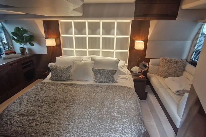 Alouise Yacht Photos Pics Luxurious bedroom interior of 2022 Galeon 460 Fly yacht with elegant decor and cozy seating.