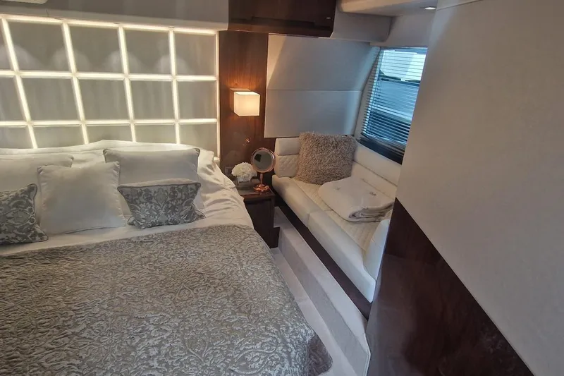 Alouise Yacht Photos Pics Luxurious bedroom interior of 2022 Galeon 460 Fly yacht with elegant decor and cozy seating.