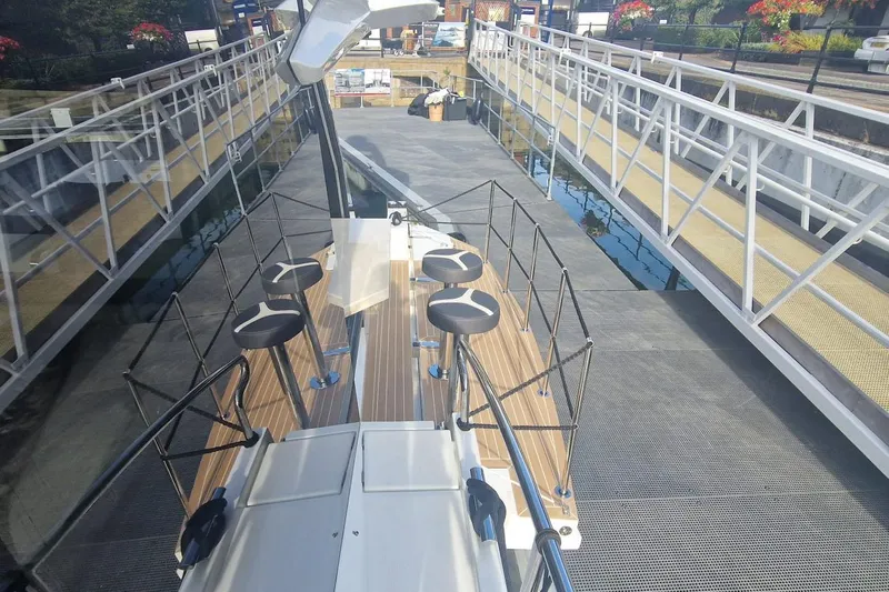 Alouise Yacht Photos Pics 2022 Galeon 460 Fly yacht docked, showcasing sleek deck design and modern railings.