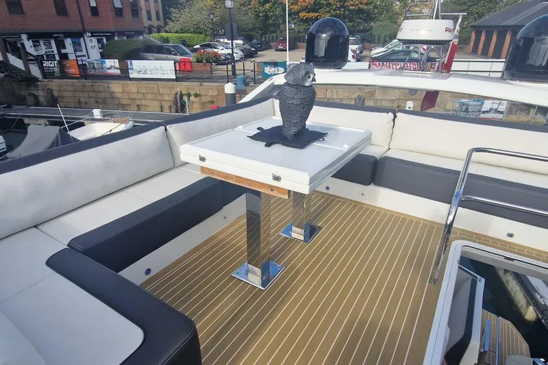 Alouise Yacht Photos Pics Luxurious seating area on 2022 Galeon 460 Fly yacht with decorative owl statue.