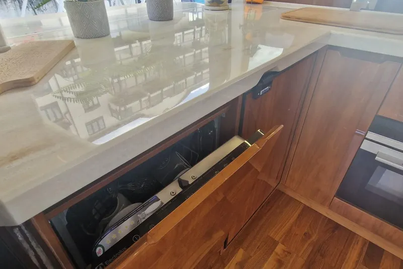 Alouise Yacht Photos Pics Modern kitchen interior on 2022 Galeon 460 Fly yacht, featuring sleek cabinetry and appliances.