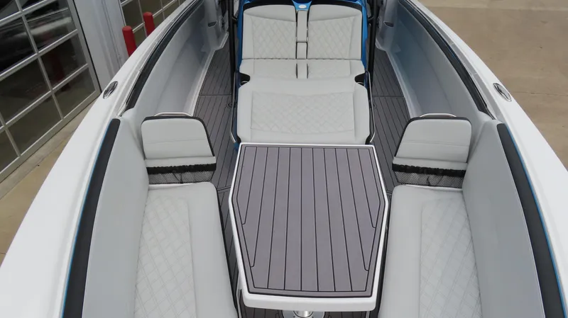  Yacht Photos Pics 2023 Nor-Tech 390 Sport Center Console interior with sleek seating and modern table design.
