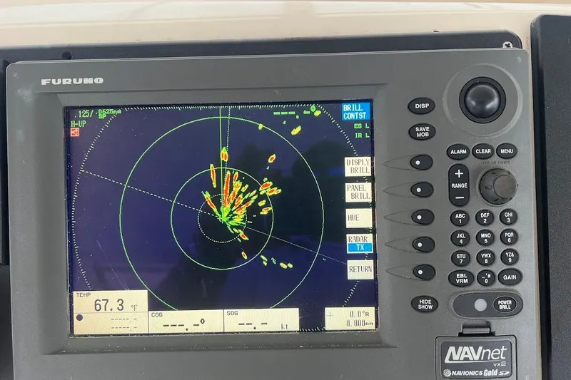  Yacht Photos Pics Radar display on 1999 Ocean Yachts 48 Express, showing navigation data and controls.