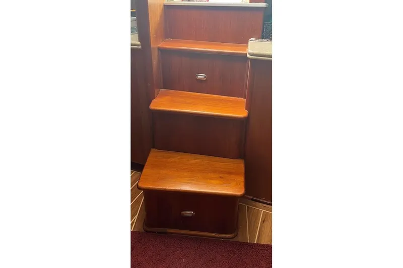  Yacht Photos Pics Wooden interior stairs on a 1999 Ocean Yachts 48 Express boat.