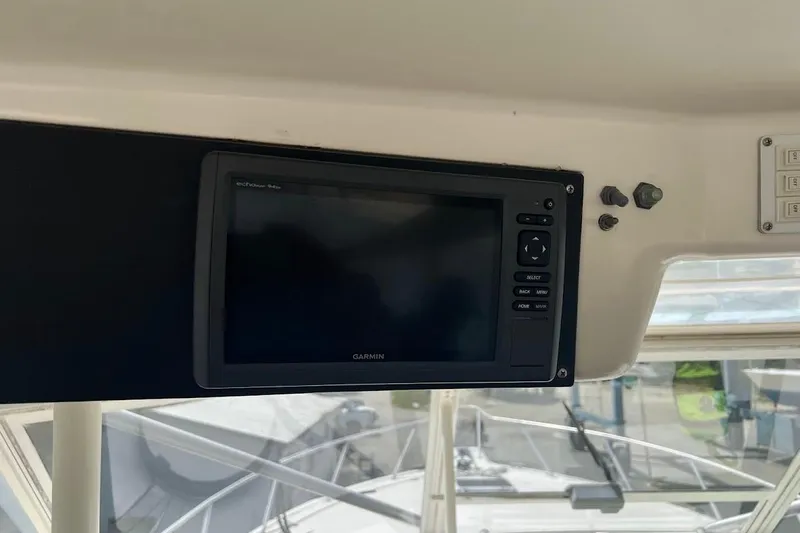  Yacht Photos Pics Garmin navigation system on 1999 Ocean Yachts 48 Express boat dashboard.