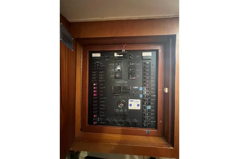  Yacht Photos Pics Electrical panel of a 1999 Ocean Yachts 48 Express boat, featuring various switches and controls.