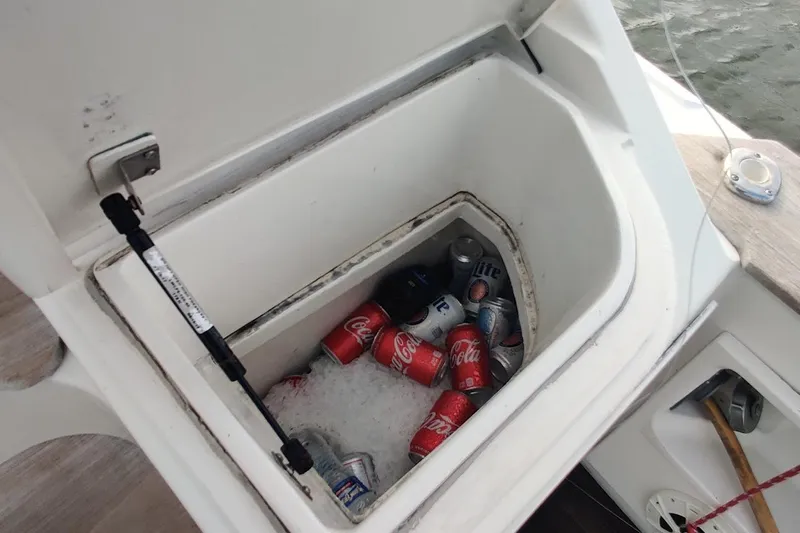 Yacht Photos Pics Cooler with drinks on 1999 Ocean Yachts 48 Express boat, filled with ice and soda cans.