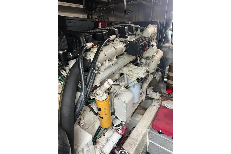  Yacht Photos Pics Engine room of a 1999 Ocean Yachts 48 Express, showcasing detailed machinery components.