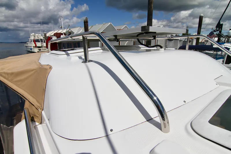  Yacht Photos Pics 2020 Ranger Tugs R-29 boat docked, showcasing roof railings and clear skies.