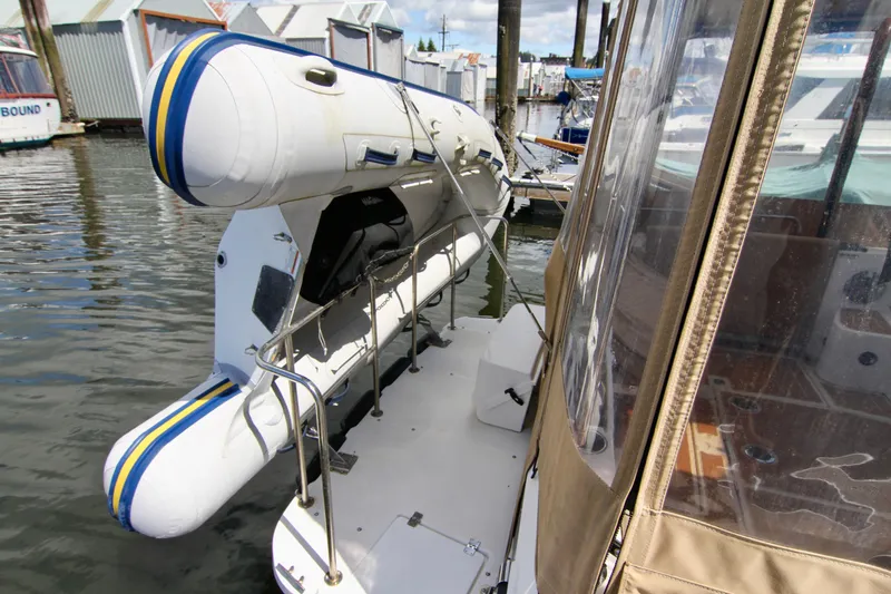  Yacht Photos Pics 2020 Ranger Tugs R-29 with inflatable dinghy on davit system at marina.