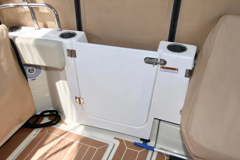  Yacht Photos Pics 2020 Ranger Tugs R-29 boat interior with white door and cup holders.