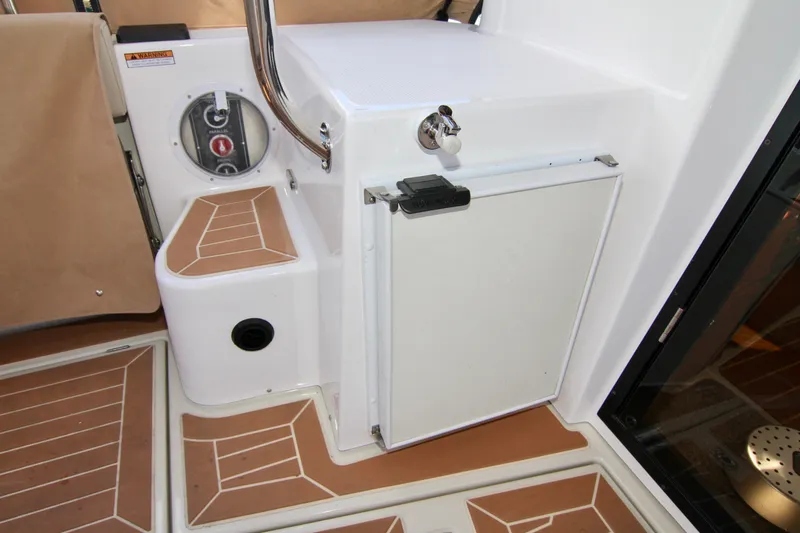  Yacht Photos Pics 2020 Ranger Tugs R-29 cockpit with storage compartment and teak flooring.