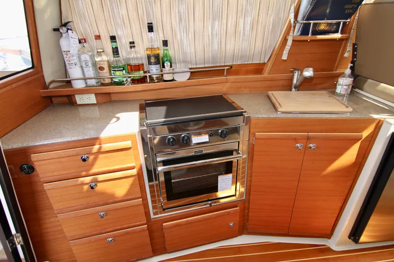  Yacht Photos Pics Modern kitchen in 2020 Ranger Tugs R-29 boat with stove, cabinets, and countertop.