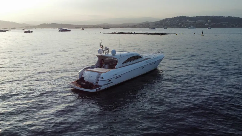  Yacht Photos Pics Luxury 2006 Rizzardi 73 yacht cruising on serene waters at sunset.