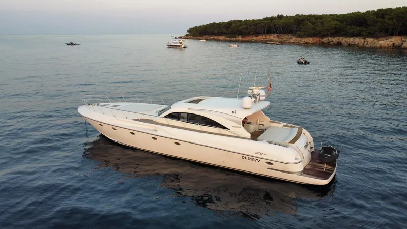  Yacht Photos Pics Luxury 2006 Rizzardi 73 yacht cruising on calm coastal waters.