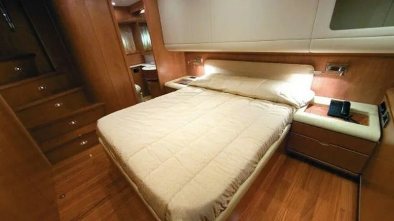  Yacht Photos Pics Luxurious cabin interior of 2006 Rizzardi 73 yacht with wooden flooring.