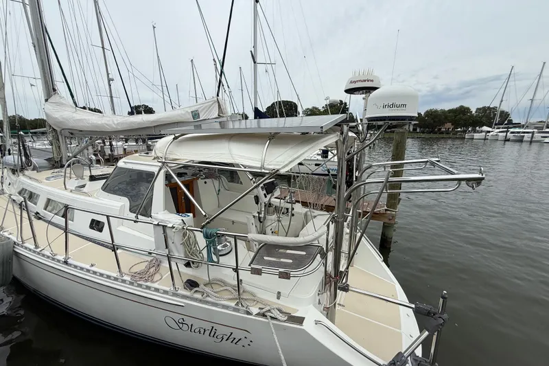 Starlight Yacht Photos Pics Sailboat docked at marina, Outbound 46 model, 2016, with solar panels and navigation equipment.