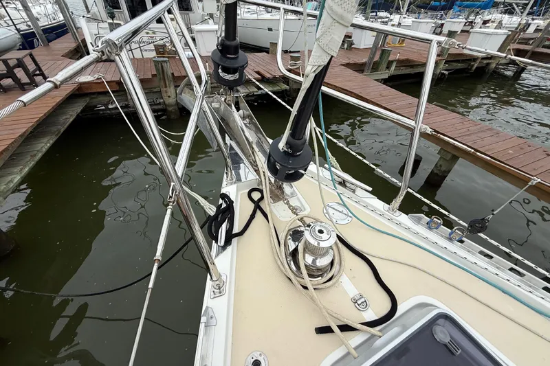 Starlight Yacht Photos Pics Deck view of a 2016 Outbound 46 sailboat docked at a marina.