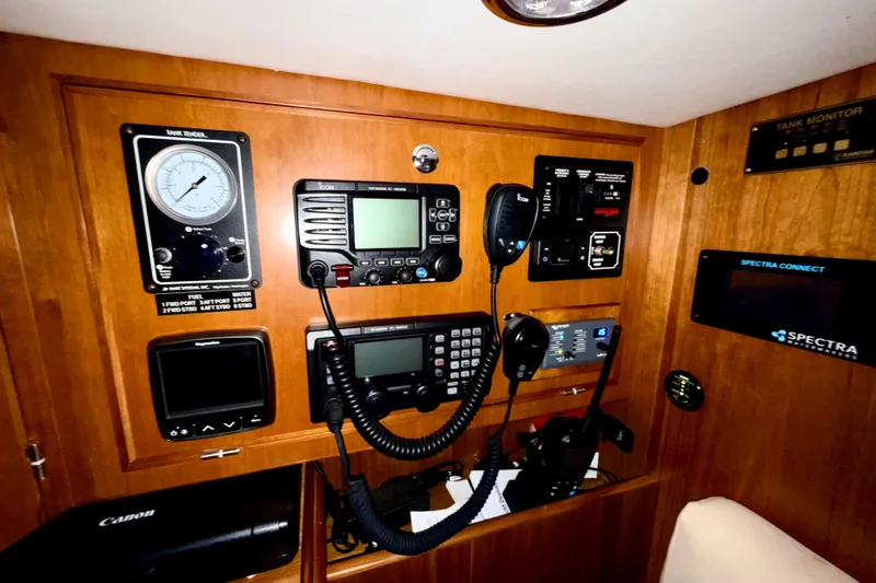 Starlight Yacht Photos Pics Control panel of a 2016 Outbound 46 yacht with navigation and communication equipment.