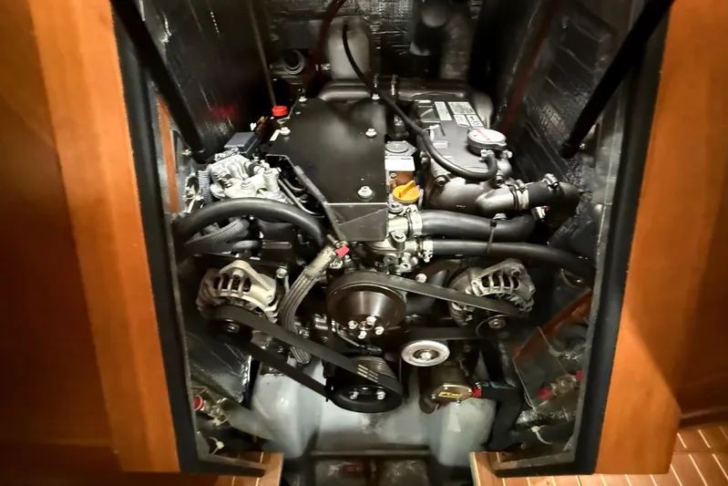 Starlight Yacht Photos Pics Engine compartment of a 2016 Outbound 46 yacht, showcasing mechanical components and belts.