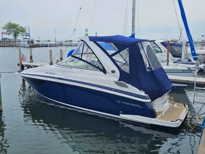 Elizabeth Anne Yacht Photos Pics 2019 Regal 28 Express boat docked in marina with blue canopy.