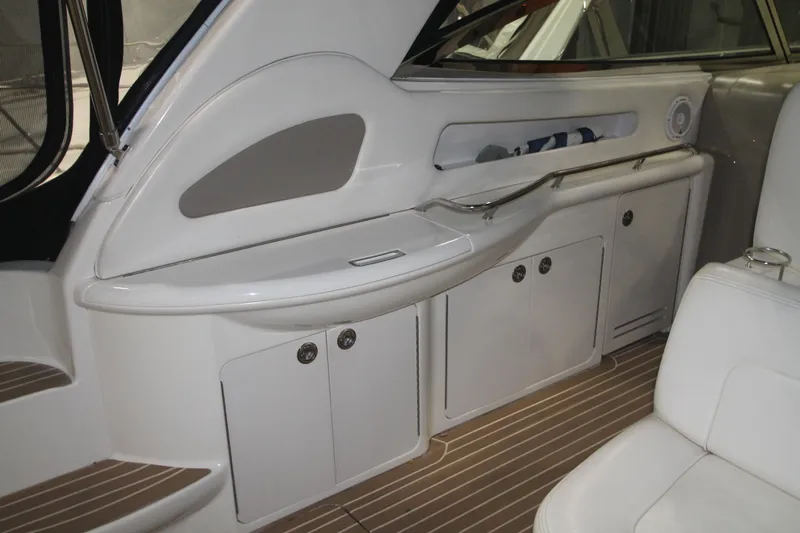 Broke R Yacht Photos Pics 1999 Sea Ray 460 Sundancer interior with sleek cabinetry and seating.