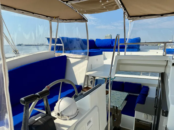Confetti Yacht Photos Pics 2016 Fountaine Pajot SABA 50 yacht interior with blue seating and helm station.