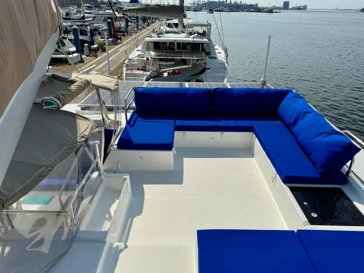 Confetti Yacht Photos Pics 2016 Fountaine Pajot SABA 50 yacht with blue seating, docked at marina.