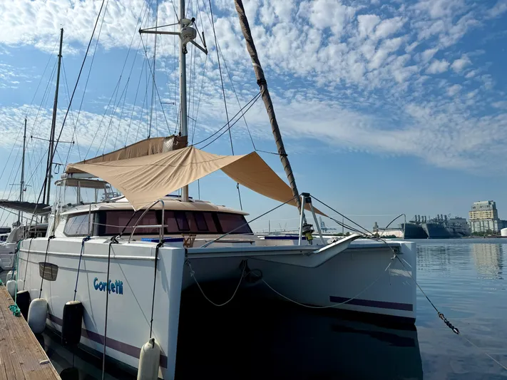Confetti Yacht Photos Pics 2016 Fountaine Pajot SABA 50 catamaran docked under a clear blue sky.