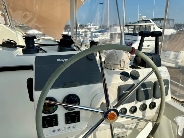 Confetti Yacht Photos Pics Steering wheel and controls of 2016 Fountaine Pajot SABA 50 yacht at marina.