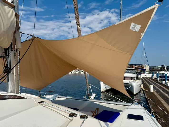 Confetti Yacht Photos Pics 2016 Fountaine Pajot SABA 50 catamaran with tan sail shade at marina.