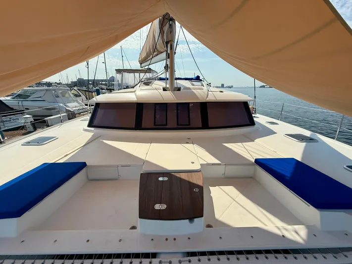 Confetti Yacht Photos Pics 2016 Fountaine Pajot SABA 50 catamaran with sunshade, docked at marina.