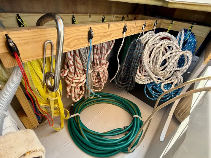 Confetti Yacht Photos Pics Storage area with neatly organized ropes and equipment on a 2016 Fountaine Pajot SABA 50.