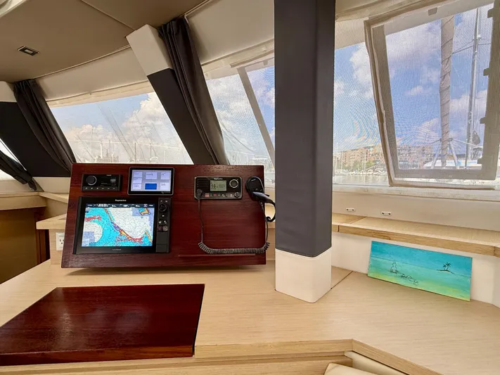 Confetti Yacht Photos Pics Interior of 2016 Fountaine Pajot SABA 50 yacht with navigation equipment and scenic window view.