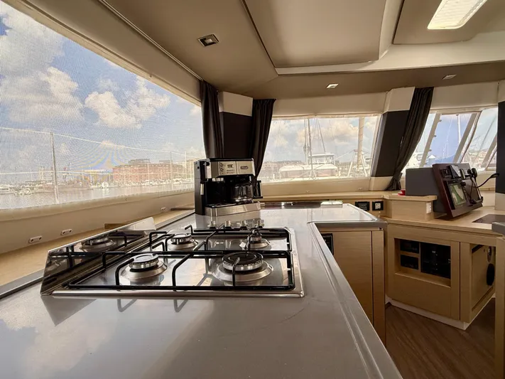 Confetti Yacht Photos Pics Interior of 2016 Fountaine Pajot SABA 50 yacht with modern kitchen and panoramic windows.