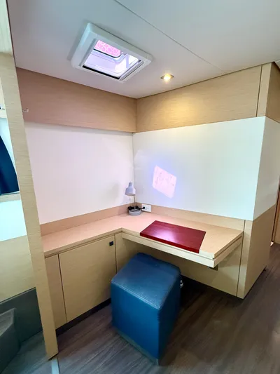 Confetti Yacht Photos Pics Interior of 2016 Fountaine Pajot SABA 50 yacht with desk and seating area.