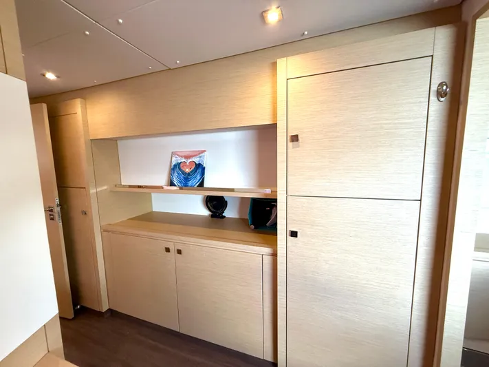 Confetti Yacht Photos Pics Interior of 2016 Fountaine Pajot SABA 50 yacht with modern wood cabinetry and artwork.