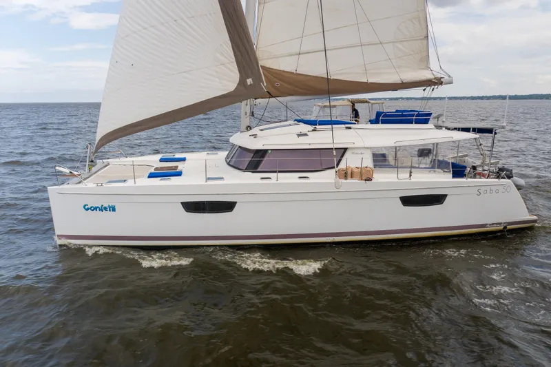 Confetti Yacht Photos Pics 2016 Fountaine Pajot SABA 50 catamaran sailing on open water.